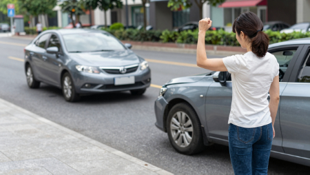 angry woman holding up a fist at hit and run driver generated with Z-Image