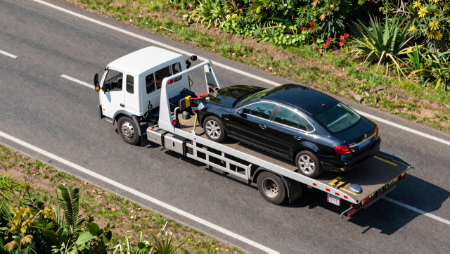 car on flat bed tow truck