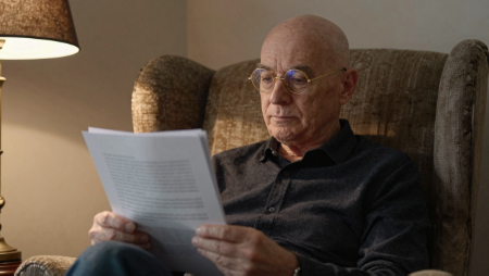 man sitting in chair reading insurance policy generated with Z-Image