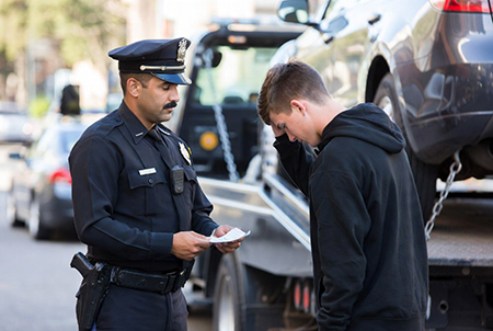 police officer ticketing driver and towing car image created with Grok AI