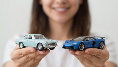 woman holding two model cars in her hands generated with Z-Image